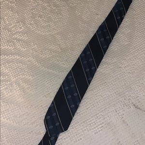 Blue tie with detail. No signs of wear